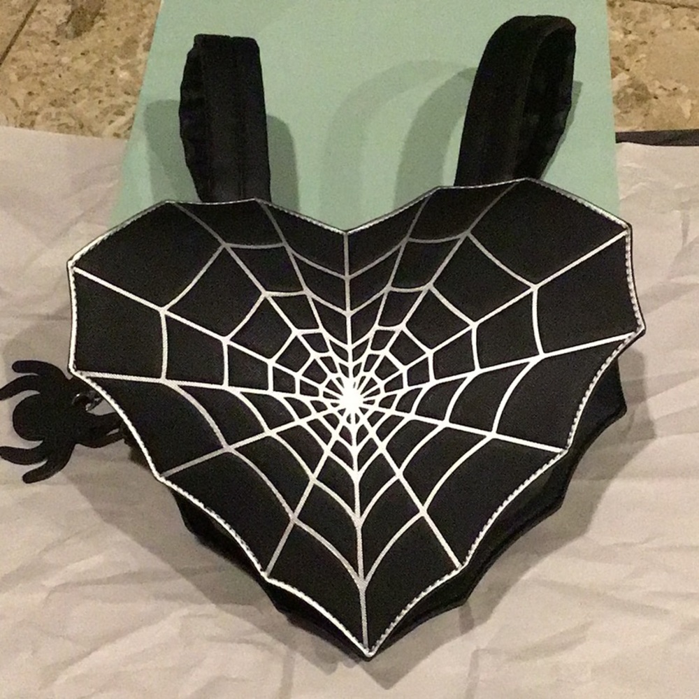 Spiderweb heart shaped backpack with spider zipper pull. Halloween novelty purse
